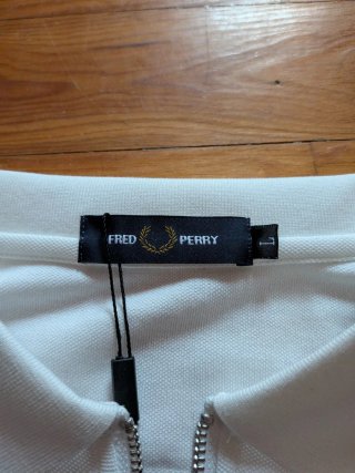 Polo Fred Perry blanco con cremallera