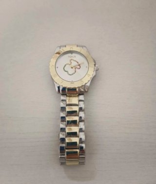 Reloj Tous bicolor con diseño de trébol de acero
