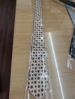 Corbata crema con estampado