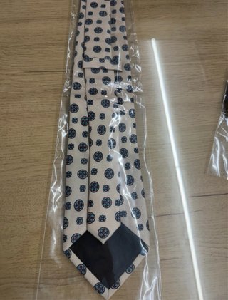 Corbata crema con estampado