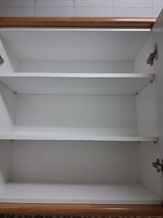 Muebles de cocina beige y marrón
