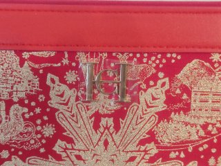 Neceser Carolina Herrera Rojo y Dorado.