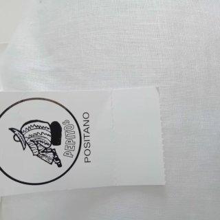 Vestitino in lino bianco con cartellino