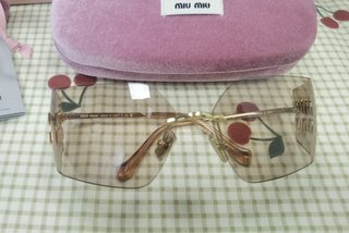 Occhiali da sole Miu Miu MU54YS
