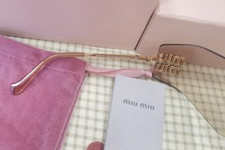 Occhiali da sole Miu Miu MU54YS