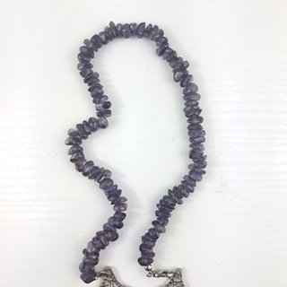 Collana etnica con ciondolo floreale