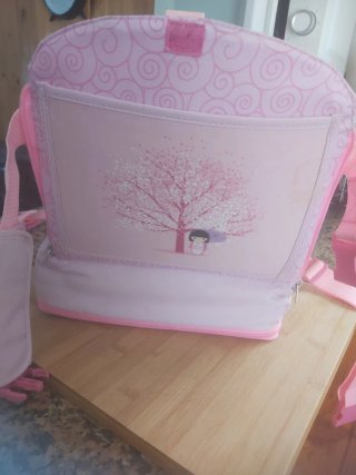 Trona de viaje rosa con estampado