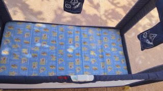Cuna de viaje azul y amarilla