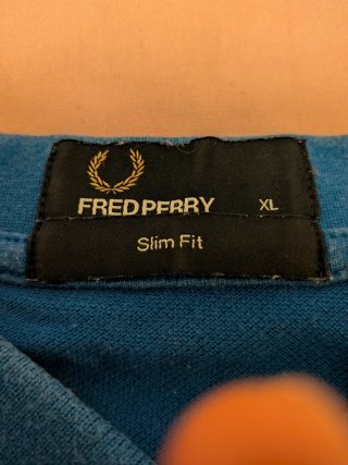 Polo Fred Perry Azul con detalles Naranja