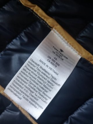 Chaqueta plumífero ligero amarillo y azul