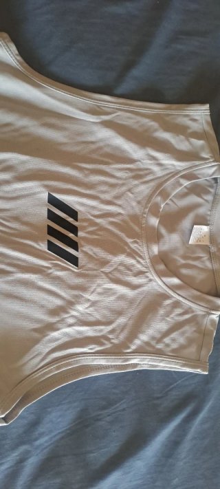 Camiseta deportiva sin mangas gris, sin estrenar