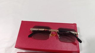 Gafas de sol Cartier doradas y grises