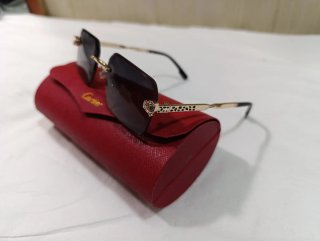Gafas de sol Cartier doradas y grises