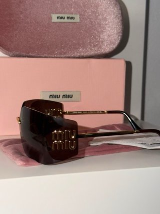Gafas de sol Miu Miu marrones y doradas