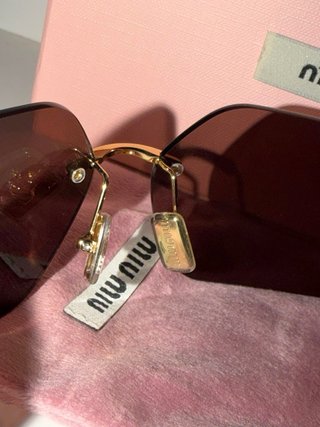 Gafas de sol Miu Miu marrones y doradas