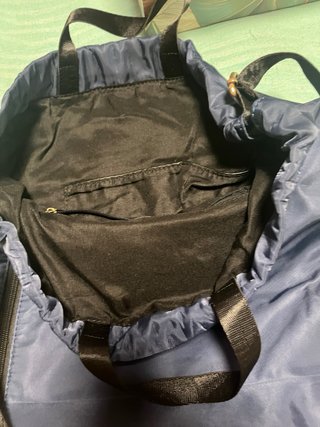 Bolsa-mochila azul con mariposa y flor