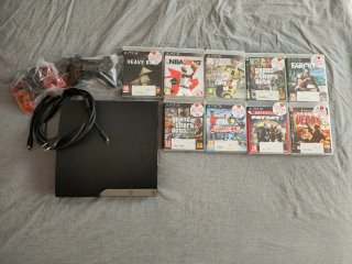 PlayStation 3, dos controles y lote de 9 juegos.