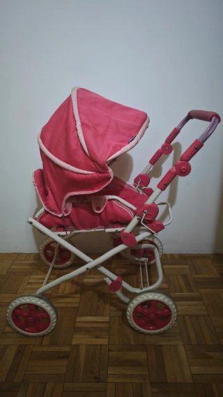 Triciclo para muñecas rosa y cochecito