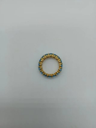 Anillo de topacios azules y oro
