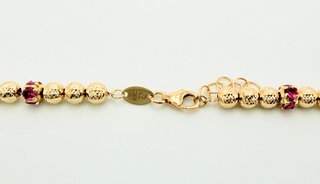 Cadena Bolas Oro 18K y piedras Rojas; 62cm 15.61gr