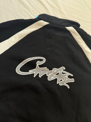Chaqueta Corteiz Vertigo Shuku Negra y Blanca