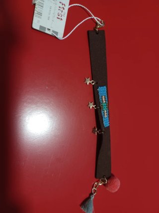 Pulsera ffst marrón con estrellas y pompón