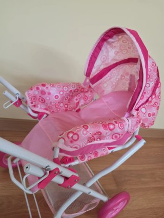 Carrito de muñecas rosa