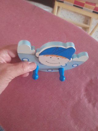 Appendiabiti per bambini con viso sorridente