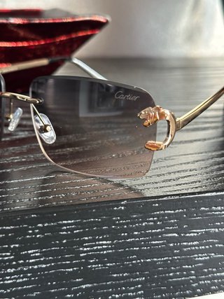 Occhiali da sole Cartier oro e marroni