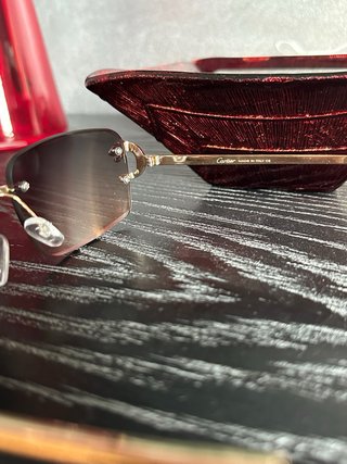 Occhiali da sole Cartier oro e marroni