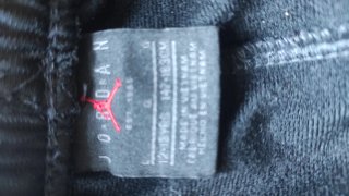 Conjunto deportivo Jordan negro y rojo