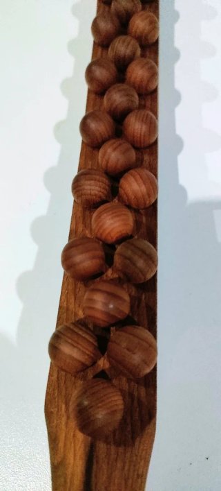 Rodillo de madera con cuentas
