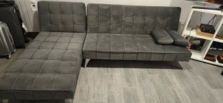 Sofá cama gris de terciopelo