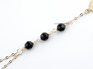 manita oro 18k con piedra con onix