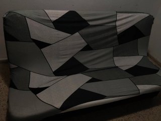Sofá-cama moderno con estampado geométrico
