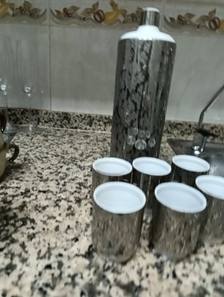 Botella y 6 vasos de licor plateados