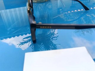 Occhiali da sole Gucci neri e oro