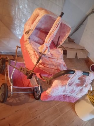Passeggino per bambole rosa