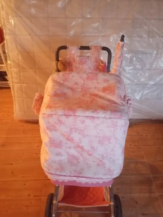 Passeggino per bambole rosa