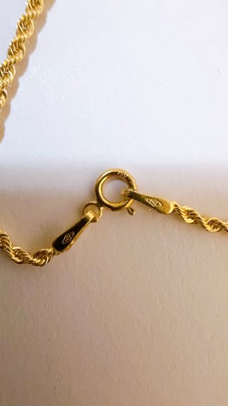 Collana con crocifisso in oro bicolore 18kt 750