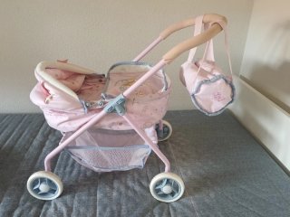 Cochecito de muñecas rosa