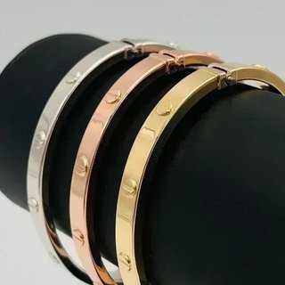 PULSERA RIGIDA TORNILLO ORO ROSA. Hueca. Oro 18k.