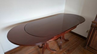 Mesa de comedor ovalada extensible de madera