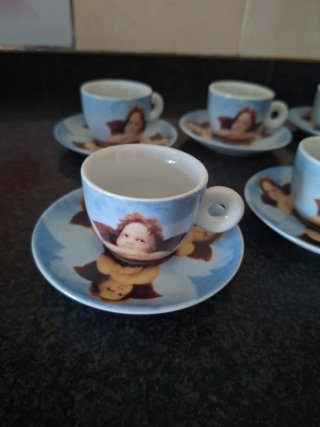 Juego de 6 tazas de café con platillos