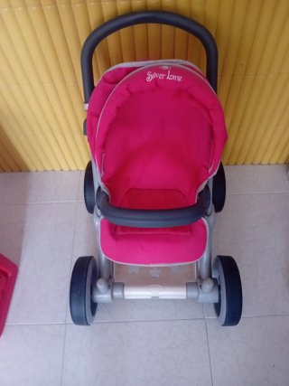 Cochecito de bebé de juguete rosa