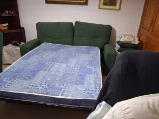 Sofá cama verde de tela