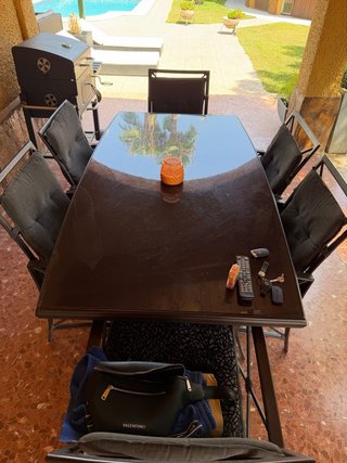 Mesa cristal exterior y 6 sillas