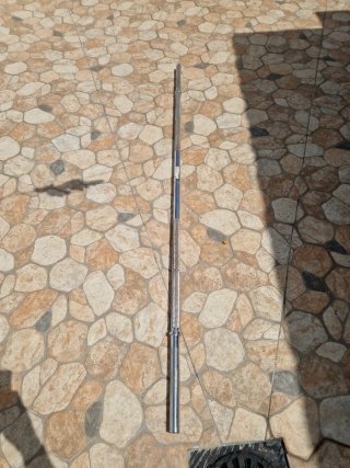 2 discos de pesa Domyos 10 kg y una barra de 175cm