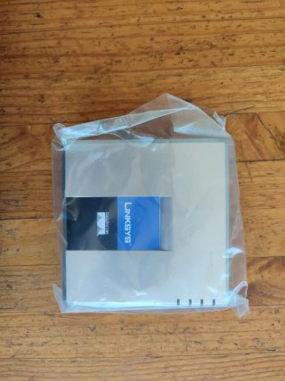 Adaptador Teléfono Internet Linksys PAP2T Caja Com