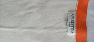 Chaqueta larga blanca con detalles naranja